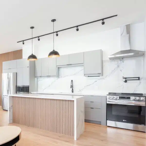 a kitchen with a marble countertop and a wood floor