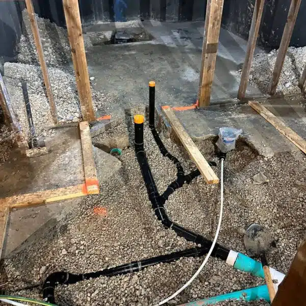 Main sewer & Main water line 13 a construction site with pipes and gravel