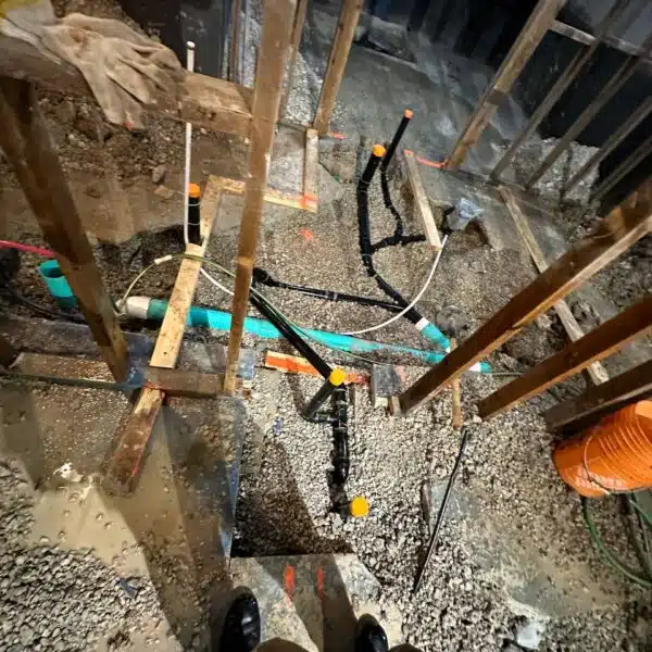 Main sewer & Main water line 14 a construction site with a pile of gravel and pipes