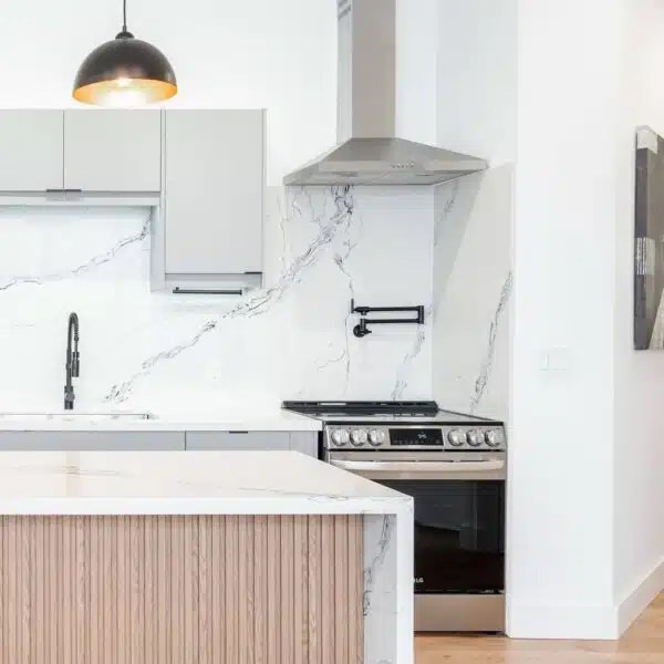 a kitchen with a marble countertop and a stove
