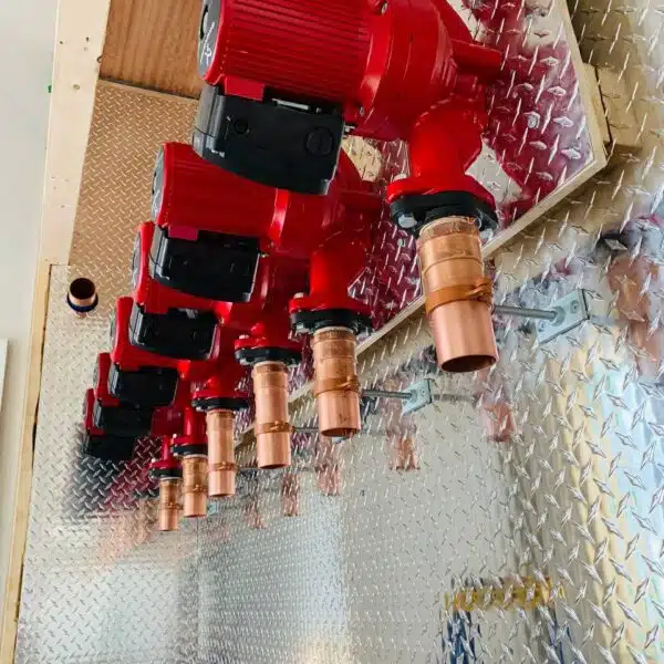 a group of red pipes from a wall