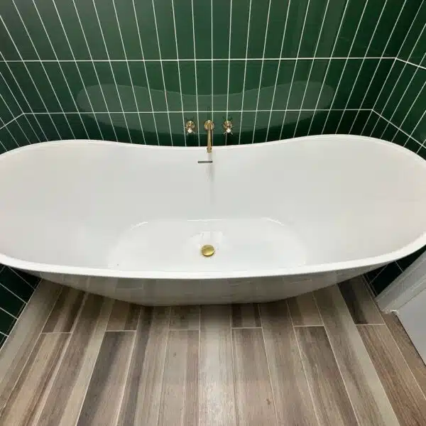 a white bathtub in a bathroom