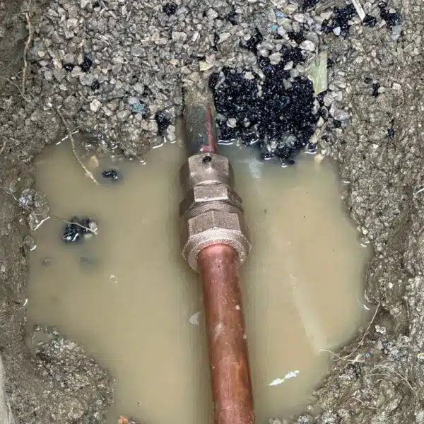 Main sewer & Main water line 7 a pipe in a hole in the dirt